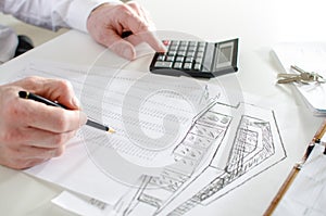 Realtor analyzing financial planning of a house