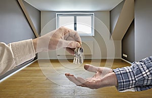 Realtor giving house key to buyer