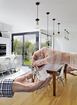 Realtor giving house key to buyer