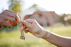 Realtor giving house key yo new owner photo