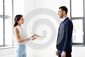 Realtor showing contract document to customer