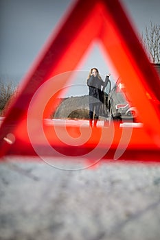 Realy angry young woman in a road distress situation