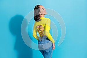 Rear behind portrait of nice positive girl closed eyes toothy smile great shape isolated on blue color background