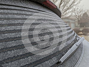 Rear defroster working on a car melting ice