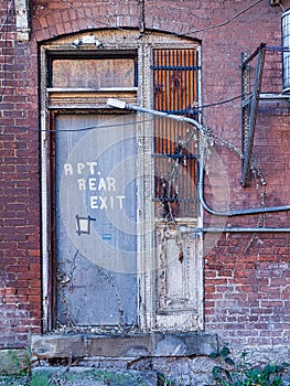 A rear door of and abandoned rooming house