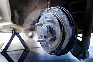 A rear hub of the car after removing a tire and wheel, maintaining a brake and wheel system