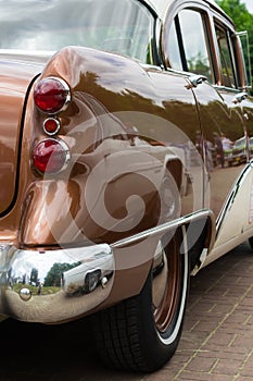 The rear lamp of an old vintage retro car. Close-up. Motor transport.