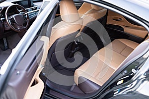 Rear leather passenger seats in modern lux car. Leather car passenger seat. Control unit with electric seat adjustment