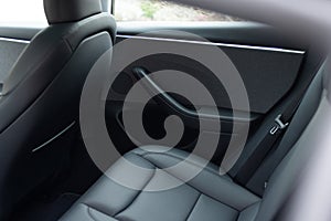 Rear leather passenger seats in modern lux car. Leather car passenger seat. Modern car interior detail