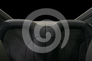 Rear leather seats. Sport car interior detail.