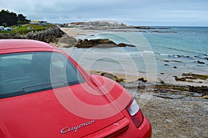 Rear light of a red Porsche Cayman 2.7 sport car, parked in fr