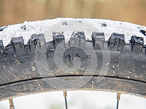 Rear mtb wheel with fat tire for extreme terrain.  Close up of a tire