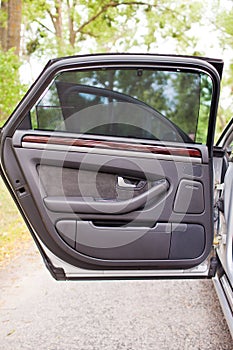 The rear open door of modern luxury car