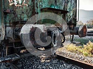 Rear part of a freight wagon with its buffers and hooks waiting to be hooked up to the rest of the railway vehicles photo