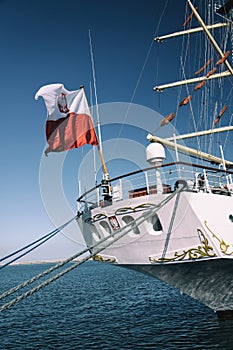 Rear part of old sailing ship moored in port