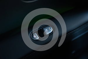 Rear passengers Seat heater button, car interior. Double seat heating switch in a car. Button for heating the rear of