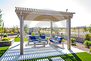 Rear Patio Pergola With Wooden Furniture photo