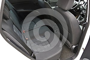 Rear seats of a car cabin.