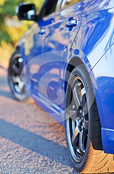 Rear side view of blue sport car