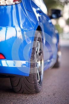 Rear side view of blue sport car