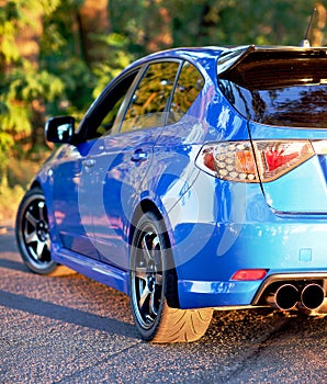 Rear side view of blue sport car