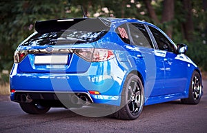 Rear side view of blue sport car