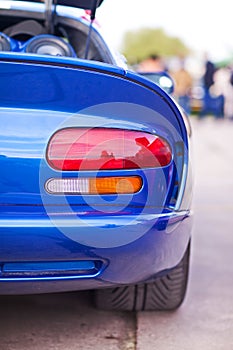 Rear side view of blue sport car