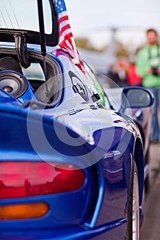 Rear side view of blue sport car