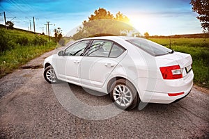 Rear-side view of car on nature background