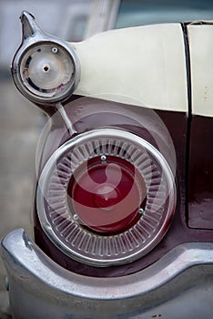 closeup of Rear Taillight and chrome bumper of Vintage muscle car