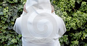 Rear view of african american woman in white hooded sweatshirt, copy space, slow motion