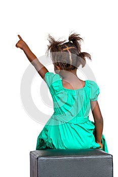 Rear view of african girl pointing with finger