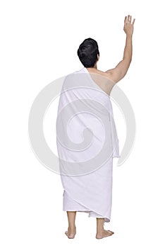 Rear view of asian muslim with ihram cloth standing