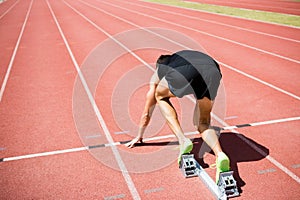 Rear view of an athlete ready to run