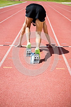 Rear view of an athlete ready to run