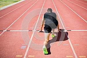 Rear view of an athlete ready to run