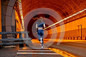 Rear view on Athlete runner feet running on road. woman fitness jog workout wellness concept.