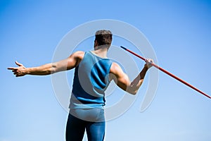 Rear view of an athlete about to throw a javelin