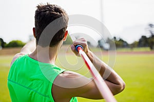 Rear view of an athlete about to throw a javelin