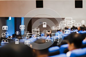 Rear view of audience attending meeting business seminar in conference room With Social Icons