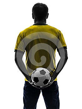 Rear view back man holding soccer football silhouette