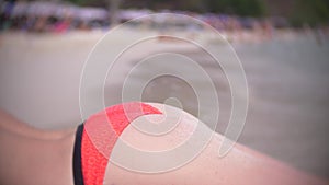 Rear view beautiful young girl at the beach back . wearing red bikini tropical vacation . close up .