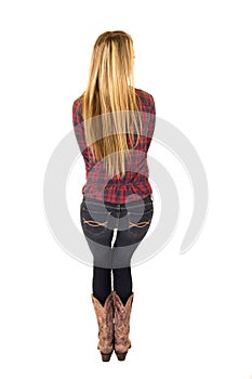 Rear-view of blond female in western clothing