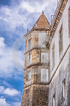 Rear view of the building of the Royal Palace, PaÃÂ§o real ; with tower, belonging to the University of Coimbra, Portugal photo