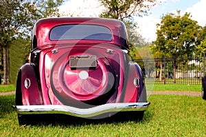 Rear view of burgundy classic car