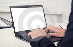 Rear view of business man hands using laptop