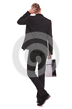 Rear view of a business man thinking