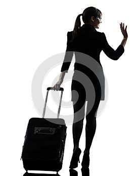 Rear view business woman traveling saluting silhouette