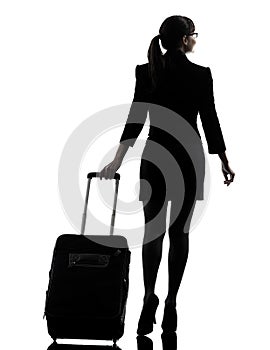 Rear view business woman traveling walking silhouette