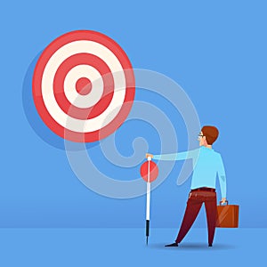 Rear view businessman holding arrow target business success concept on blue background flat